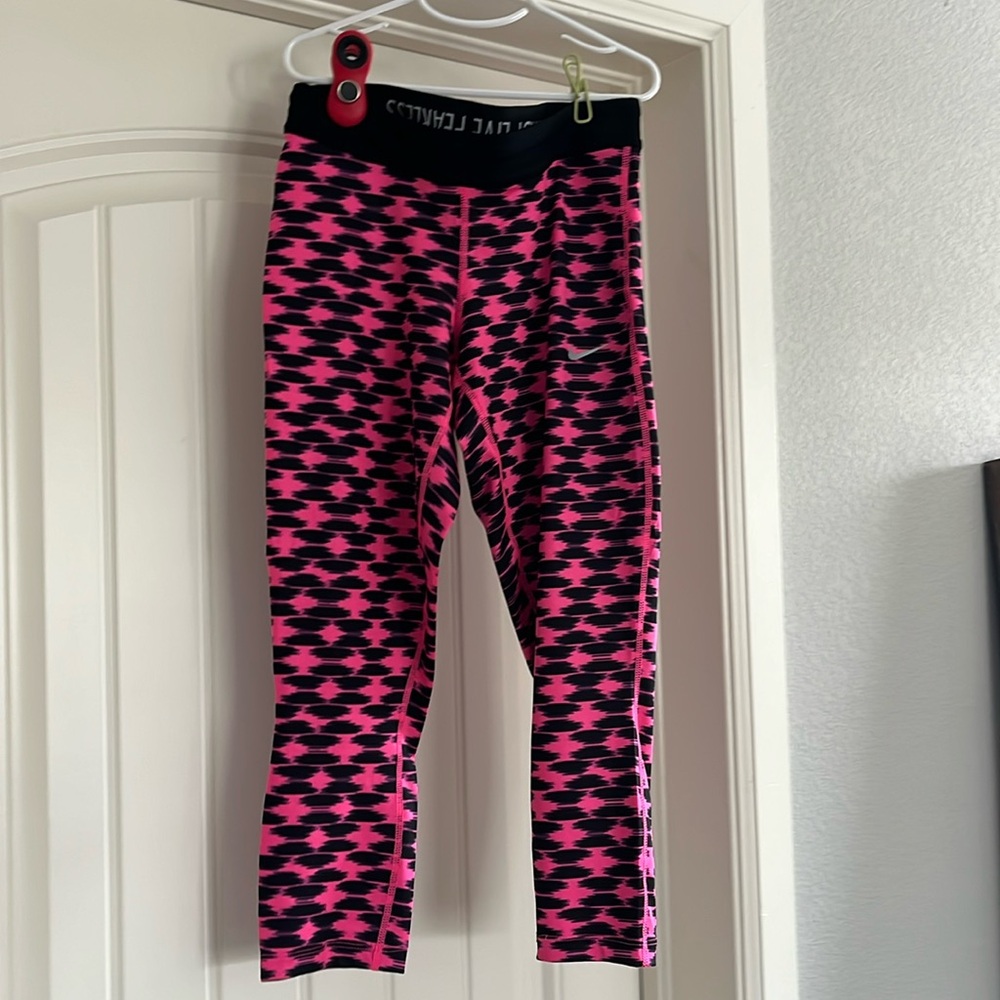 Pink and black Nike Dri Fit capri tights